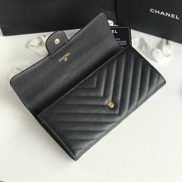 Chanel black chevron caviar gold hardware wallet